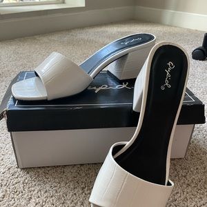 White low heel slip on sandals